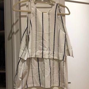 White shirt with black vertical stripes.